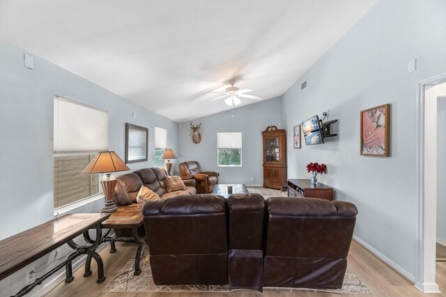518 Marine Way, Freeport, TX 77541 - living room with light wood-style flooring, ceiling fan, vaulted ceiling, and baseboards