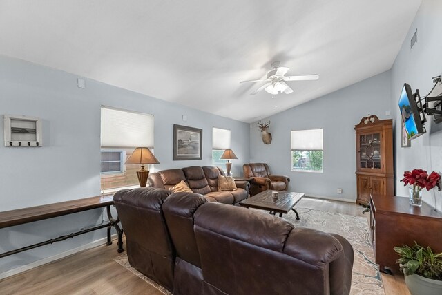 518 Marine Way, Freeport, TX 77541 - living area with vaulted ceiling, light wood finished floors, and a ceiling fan