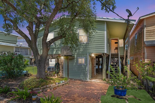 518 Marine Way, Freeport, TX 77541 - view of property with stairway, fence, a patio, and cooling unit