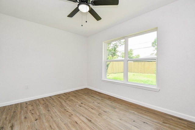 1915 Springrock Ln, Houston, TX 77080 - spare room featuring light wood-style floors, baseboards, and ceiling fan