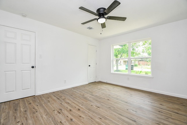 1915 Springrock Ln, Houston, TX 77080 - spare room with wood finished floors, baseboards, and ceiling fan