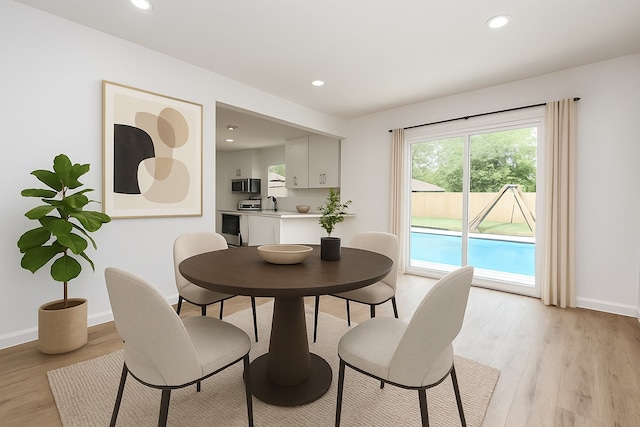 1915 Springrock Ln, Houston, TX 77080 - dining room featuring light wood finished floors, recessed lighting, and baseboards
