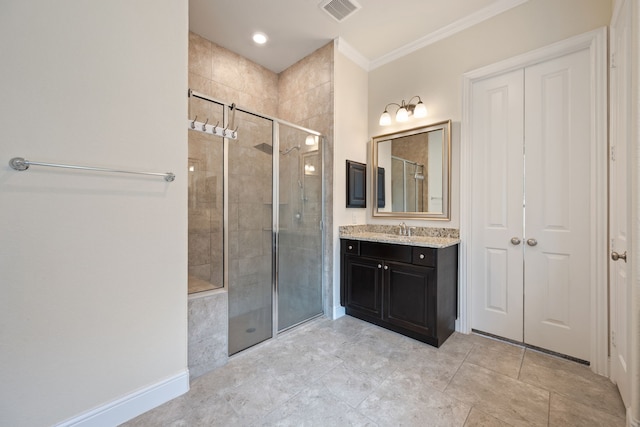 bathroom with a stall shower, crown molding, and vanity