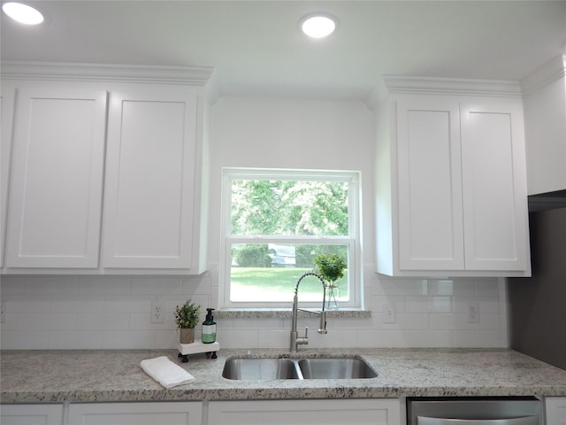 846 Magnolia St, Lake Jackson, TX 77566 - kitchen with white cabinetry, decorative backsplash, dishwasher, light stone countertops, and recessed lighting