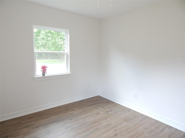 846 Magnolia St, Lake Jackson, TX 77566 - unfurnished room with light wood-style floors and baseboards