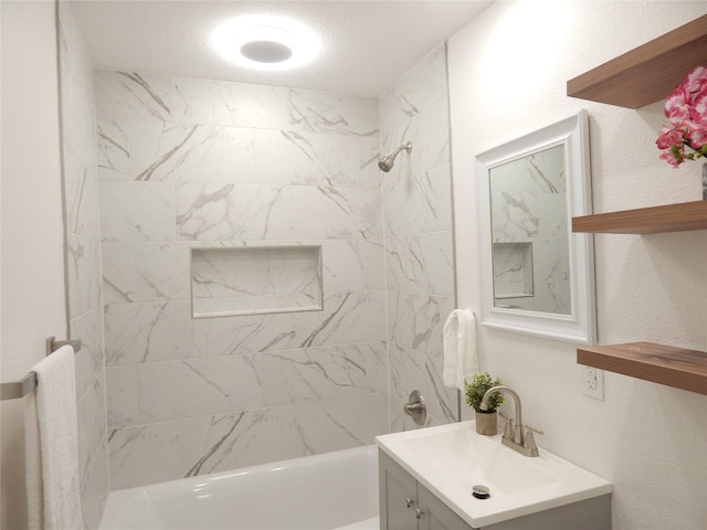 846 Magnolia St, Lake Jackson, TX 77566 - bathroom featuring vanity, shower / bathtub combination, and a textured wall