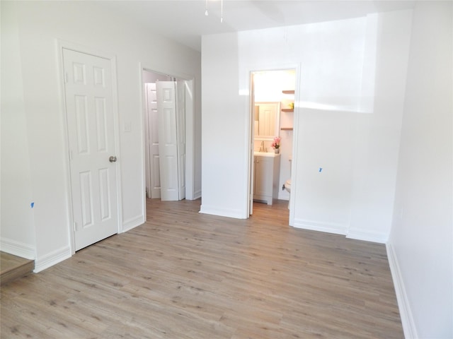 846 Magnolia St, Lake Jackson, TX 77566 - unfurnished bedroom with light wood-style flooring and ensuite bathroom