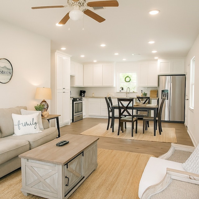 846 Magnolia St, Lake Jackson, TX 77566 - living room with light wood finished floors, a ceiling fan, and recessed lighting