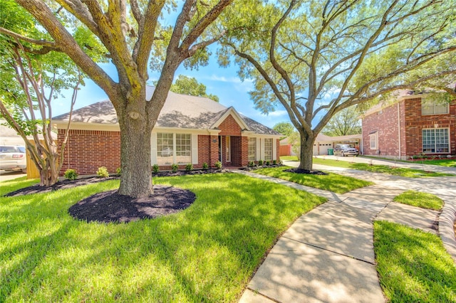12507 Antean Way Ct, Houston, TX 77065 - view of front of house with a front yard and brick siding