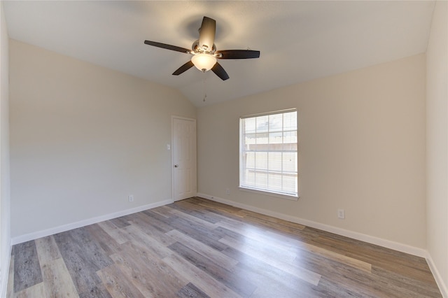 12507 Antean Way Ct, Houston, TX 77065 - spare room featuring light wood finished floors, ceiling fan, vaulted ceiling, and baseboards