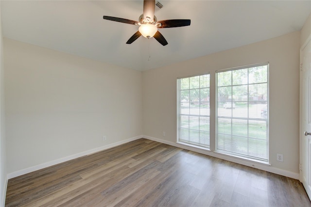12507 Antean Way Ct, Houston, TX 77065 - unfurnished room with wood finished floors, a ceiling fan, and baseboards