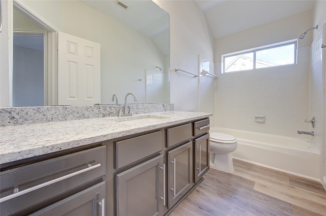 12507 Antean Way Ct, Houston, TX 77065 - bathroom with wood finished floors, toilet, shower / tub combination, vanity, and vaulted ceiling