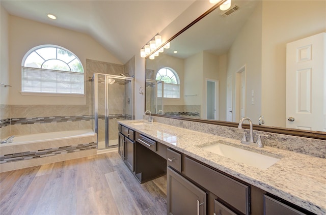 12507 Antean Way Ct, Houston, TX 77065 - full bathroom with plenty of natural light, lofted ceiling, a shower stall, a garden tub, and double vanity