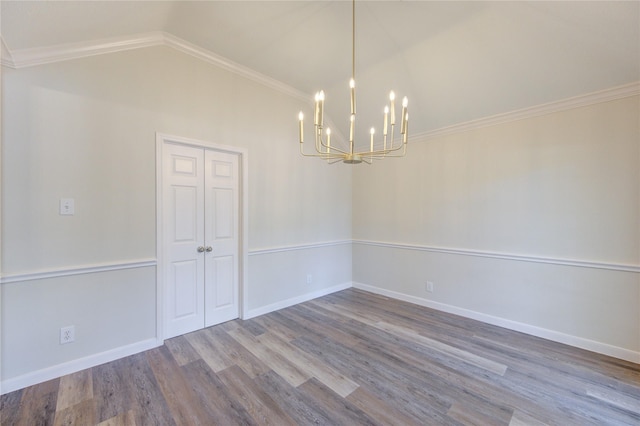 12507 Antean Way Ct, Houston, TX 77065 - unfurnished room featuring a chandelier, wood finished floors, vaulted ceiling, baseboards, and ornamental molding