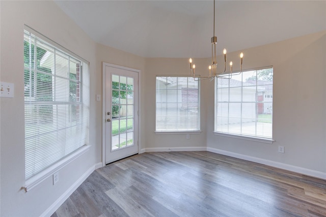 12507 Antean Way Ct, Houston, TX 77065 - unfurnished dining area with a chandelier, wood finished floors, and baseboards
