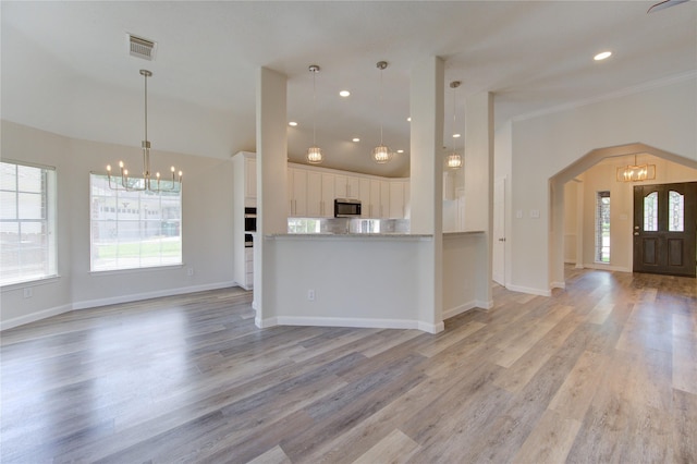 12507 Antean Way Ct, Houston, TX 77065 - kitchen with a chandelier, healthy amount of natural light, stainless steel microwave, and recessed lighting