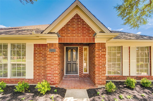 12507 Antean Way Ct, Houston, TX 77065 - view of exterior entry with brick siding and roof with shingles