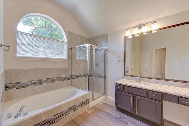 12507 Antean Way Ct, Houston, TX 77065 - full bathroom featuring vanity, a stall shower, lofted ceiling, a bath, and wood finished floors