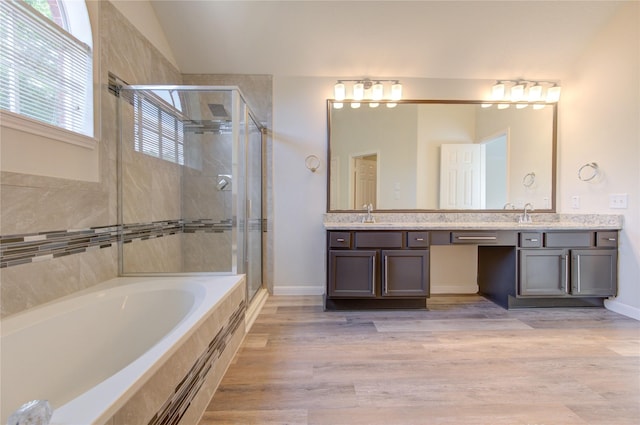 12507 Antean Way Ct, Houston, TX 77065 - bathroom with a shower stall, a garden tub, double vanity, wood finished floors, and lofted ceiling