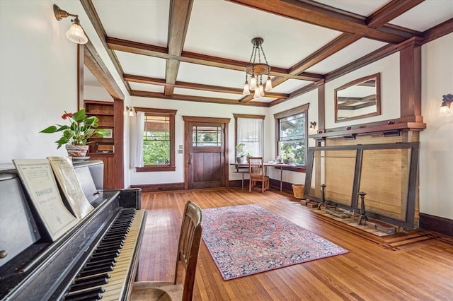 605 Sue St, Houston, TX 77009 - entrance foyer featuring baseboards, a chandelier, coffered ceiling, plenty of natural light, and wood-type flooring