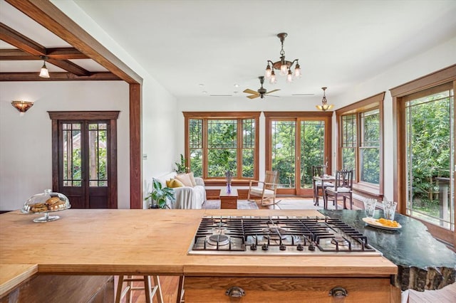 605 Sue St, Houston, TX 77009 - kitchen featuring stainless steel gas stovetop, a chandelier, and healthy amount of natural light