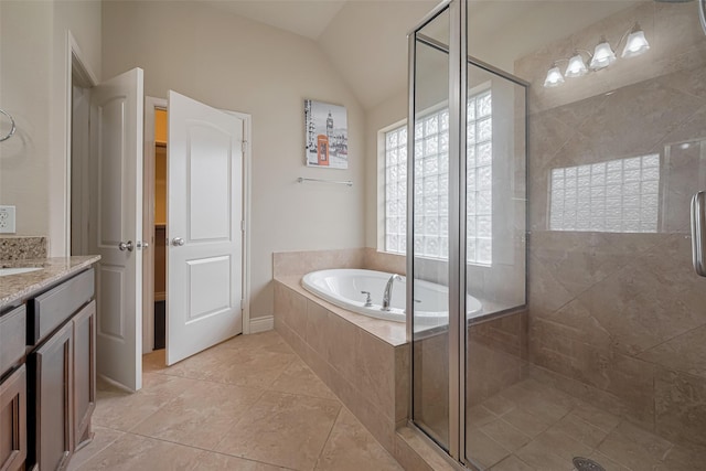full bath with a stall shower, a garden tub, vanity, tile patterned flooring, and lofted ceiling