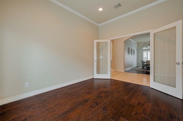 unfurnished room featuring french doors, wood finished floors, ornamental molding, baseboards, and recessed lighting