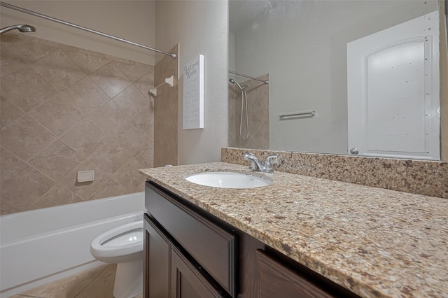 bathroom featuring toilet, washtub / shower combination, vanity, and tile patterned floors