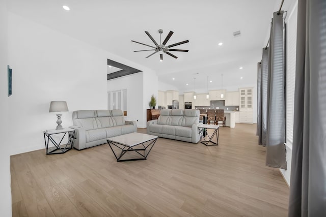 1827 Woodtrace Blvd, Pinehurst, TX 77362 - living area with ceiling fan, light wood-style flooring, baseboards, and recessed lighting