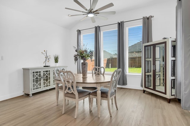 1827 Woodtrace Blvd, Pinehurst, TX 77362 - dining space with a ceiling fan, light wood-style flooring, baseboards, and vaulted ceiling