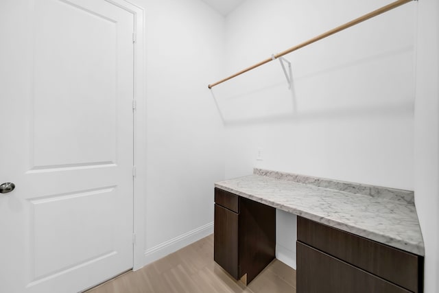 1827 Woodtrace Blvd, Pinehurst, TX 77362 - walk in closet with light wood finished floors
