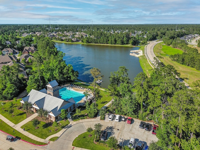 1827 Woodtrace Blvd, Pinehurst, TX 77362 - bird's eye view of a large body of water, a pool, and a tree filled landscape