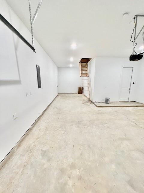 1827 Woodtrace Blvd, Pinehurst, TX 77362 - garage featuring electric panel and a garage door opener