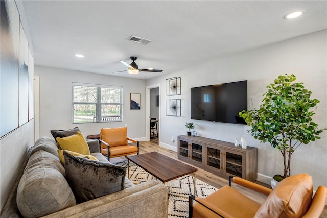 3814 Seabrook St, Houston, TX 77021 - living room with light wood finished floors, baseboards, recessed lighting, and ceiling fan