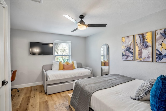 3814 Seabrook St, Houston, TX 77021 - bedroom with wood finished floors, a ceiling fan, and baseboards
