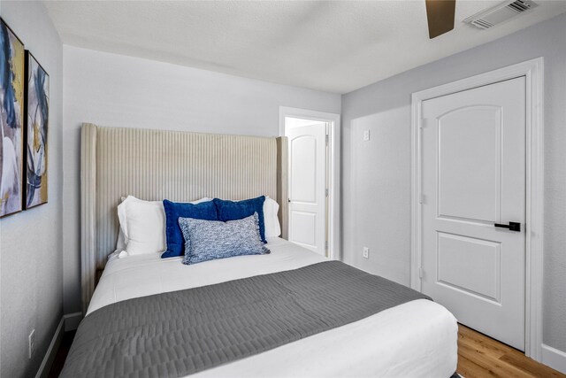 3814 Seabrook St, Houston, TX 77021 - bedroom with wood finished floors and ceiling fan
