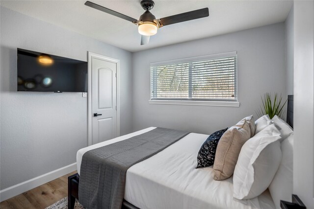3814 Seabrook St, Houston, TX 77021 - bedroom featuring wood finished floors, baseboards, and ceiling fan