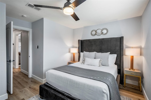 3814 Seabrook St, Houston, TX 77021 - bedroom with light wood finished floors, baseboards, and ceiling fan