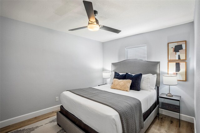 3814 Seabrook St, Houston, TX 77021 - bedroom with light wood-style floors, baseboards, and ceiling fan