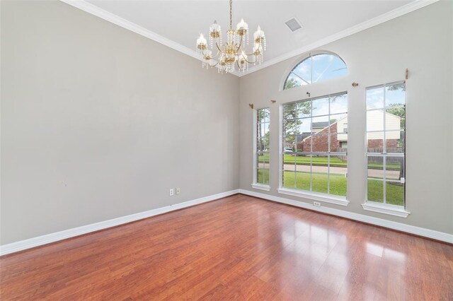 1102 Indian Autumn Trce, Houston, TX 77062 - empty room featuring a chandelier, baseboards, ornamental molding, and wood finished floors