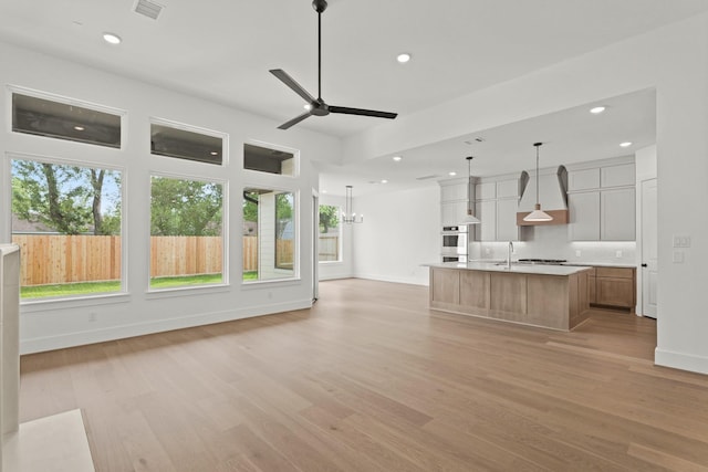 1827 Chantilly Ln, Houston, TX 77018 - kitchen with a sink, baseboards, open floor plan, light wood-style floors, and recessed lighting