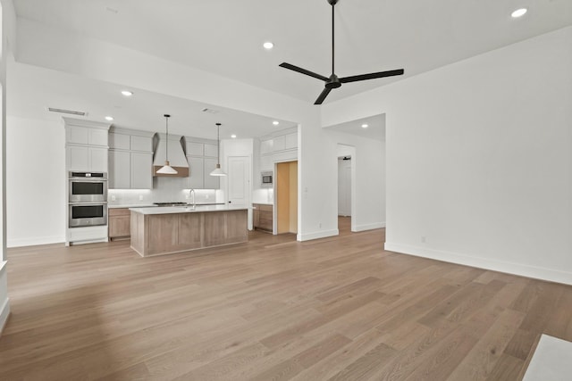1827 Chantilly Ln, Houston, TX 77018 - kitchen with open floor plan, stainless steel appliances, light wood-type flooring, decorative backsplash, and recessed lighting