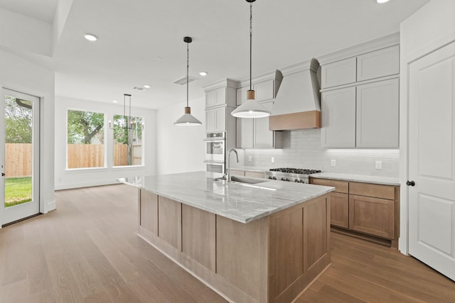 1827 Chantilly Ln, Houston, TX 77018 - kitchen with a sink, custom exhaust hood, stainless steel appliances, recessed lighting, and backsplash