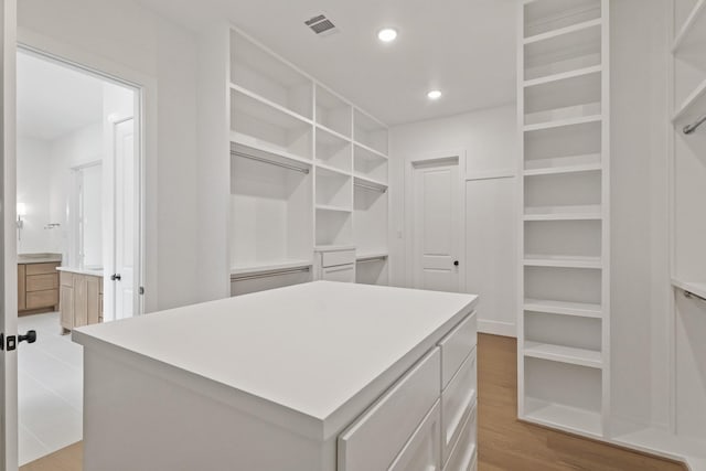 1827 Chantilly Ln, Houston, TX 77018 - spacious closet featuring light wood-type flooring