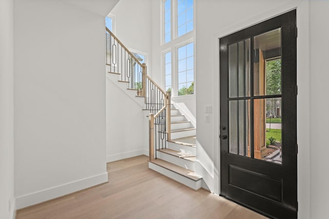 1827 Chantilly Ln, Houston, TX 77018 - entryway with wood finished floors, baseboards, stairs, and a towering ceiling