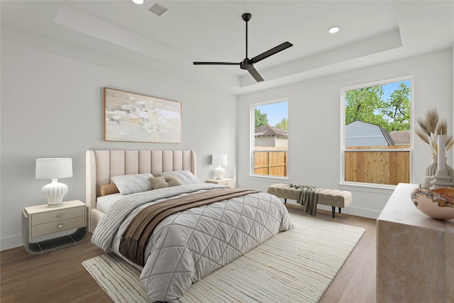 1827 Chantilly Ln, Houston, TX 77018 - bedroom with a raised ceiling, wood finished floors, baseboards, ceiling fan, and recessed lighting