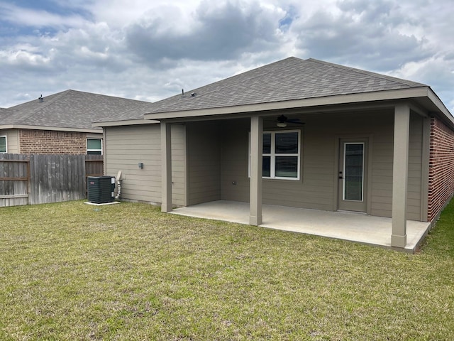910 Whispering Winds Dr, Beasley, TX 77417 - back of house with ceiling fan, roof with shingles, a patio area, and central AC