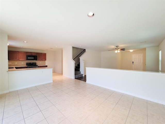 26118 Flinton Dr, Richmond, TX 77406 - unfurnished living room featuring light tile patterned flooring, a ceiling fan, recessed lighting, stairway, and baseboards
