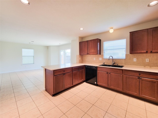 26118 Flinton Dr, Richmond, TX 77406 - kitchen featuring a sink, dishwasher, light countertops, tasteful backsplash, and recessed lighting