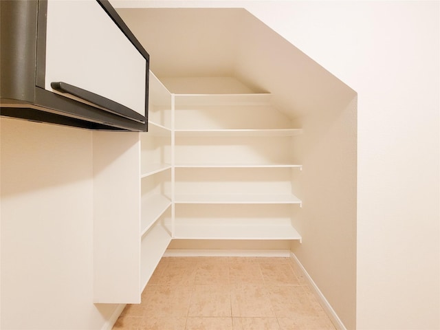 26118 Flinton Dr, Richmond, TX 77406 - walk in closet featuring tile patterned flooring